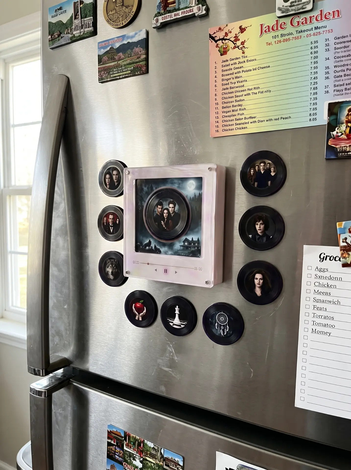 Echofy music box magnet on a kitchen fridge with song discs around it