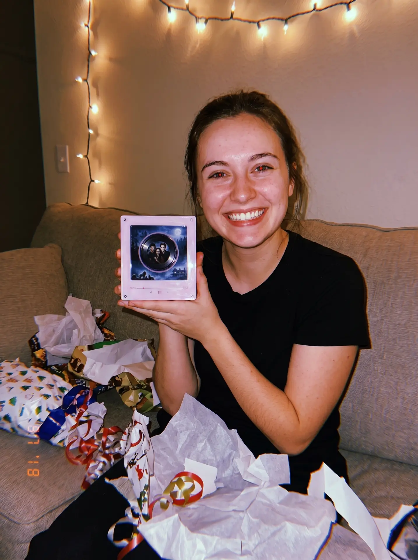 Someone holding an Echofy music box magnet after unwrapping it